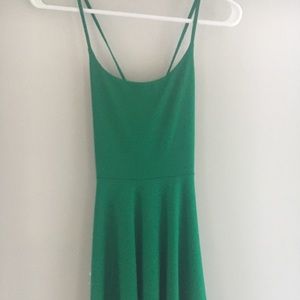Green slip dress. Ties in back. Very stretchy.